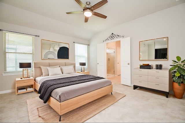 bedroom with connected bathroom, ceiling fan, multiple windows, and lofted ceiling