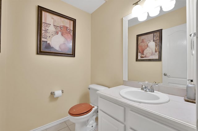 bathroom featuring tile patterned floors, vanity, and toilet