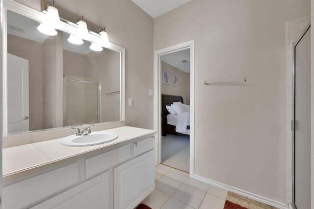 bathroom with tile patterned floors, vanity, and a shower with shower door