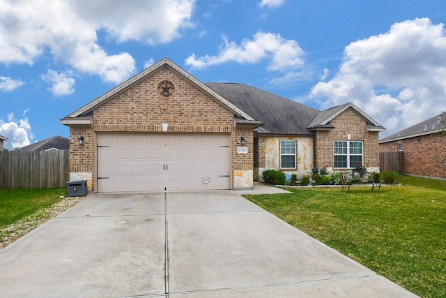 view of front of house featuring a garage and a front yard