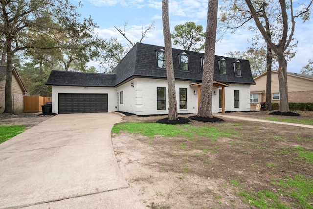 cape cod home with a garage