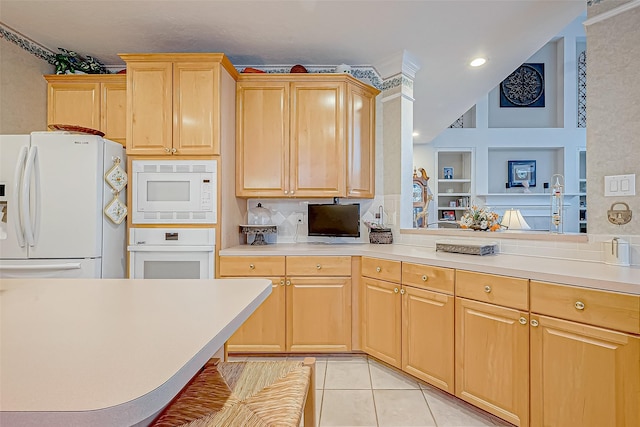 kitchen with built in features, light brown cabinetry, light tile patterned floors, and white appliances