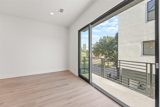 empty room with light hardwood / wood-style floors
