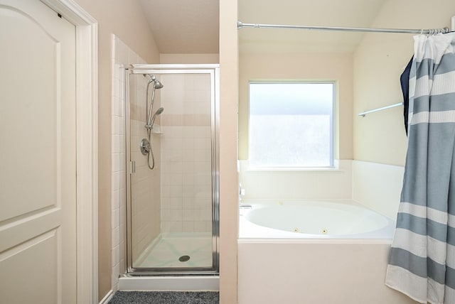 bathroom with shower with separate bathtub