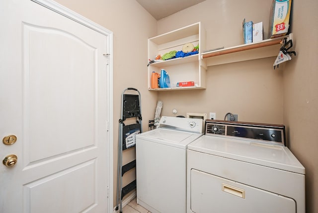 clothes washing area featuring washing machine and dryer