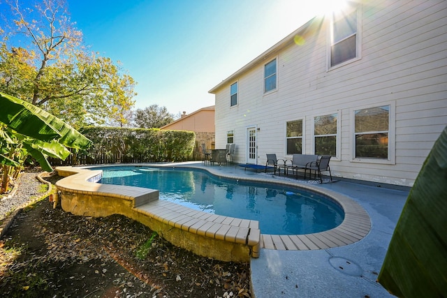 view of swimming pool with a patio area