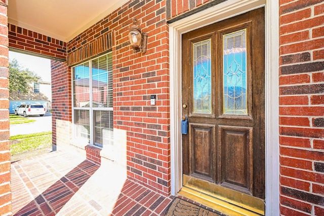 doorway to property with a porch