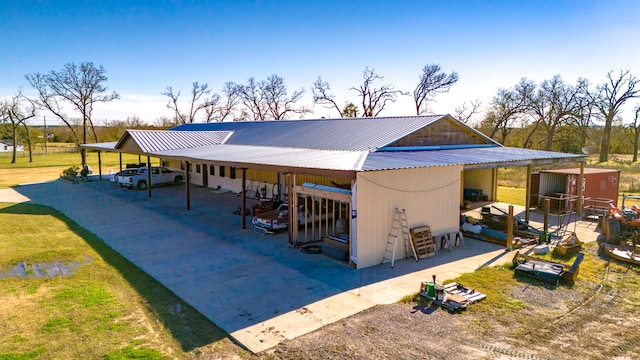 exterior space with a carport