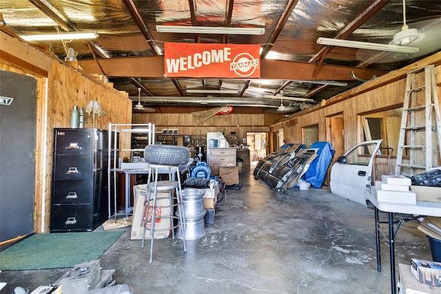 garage featuring wooden walls