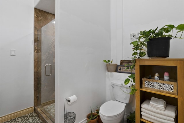 bathroom featuring toilet and walk in shower