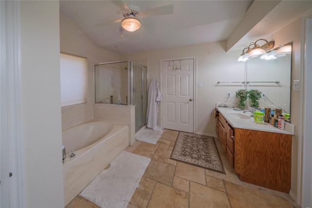 bathroom featuring ceiling fan, vanity, and independent shower and bath