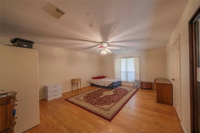 bedroom featuring ceiling fan and light hardwood / wood-style flooring