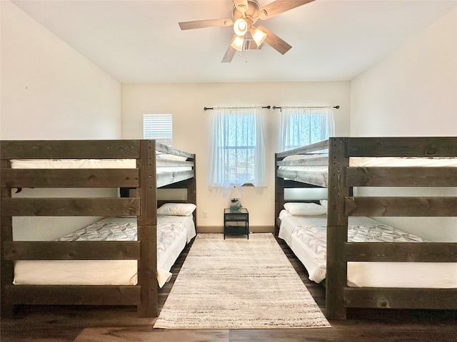 bedroom featuring ceiling fan and hardwood / wood-style flooring