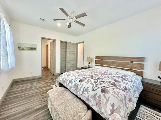 bedroom featuring ceiling fan and hardwood / wood-style floors