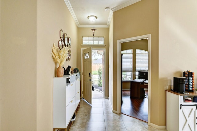 tiled foyer with ornamental molding