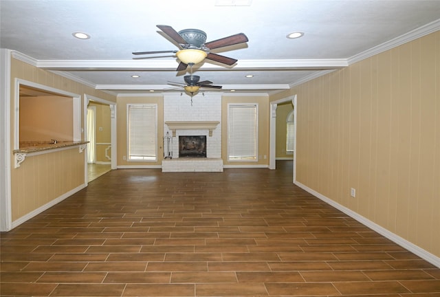 unfurnished living room featuring beamed ceiling, crown molding, and a fireplace