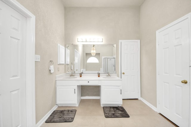 bathroom with vanity, tile patterned floors, and walk in shower