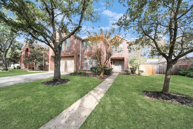 view of front of property with a garage and a front yard