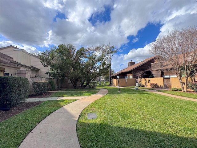 surrounding community featuring a yard