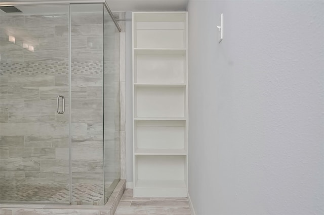 bathroom with an enclosed shower