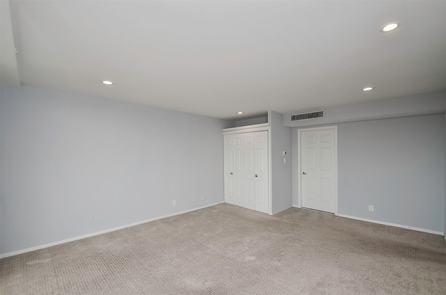 empty room featuring light colored carpet