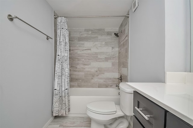 full bathroom with vanity, toilet, and shower / tub combo with curtain