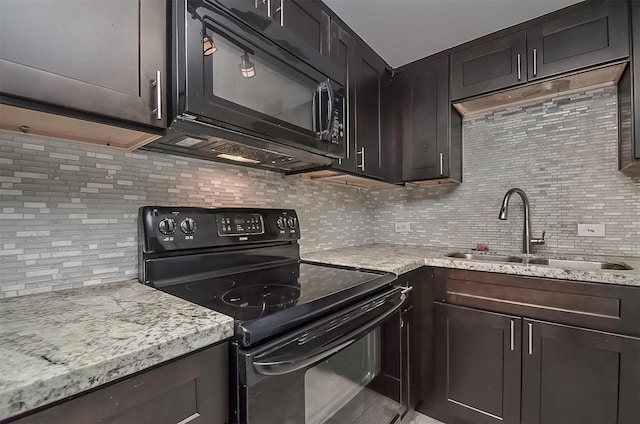 kitchen featuring black appliances, dark brown cabinetry, sink, and tasteful backsplash