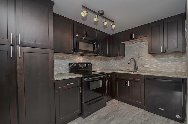 kitchen with backsplash, black appliances, sink, light stone countertops, and dark brown cabinetry