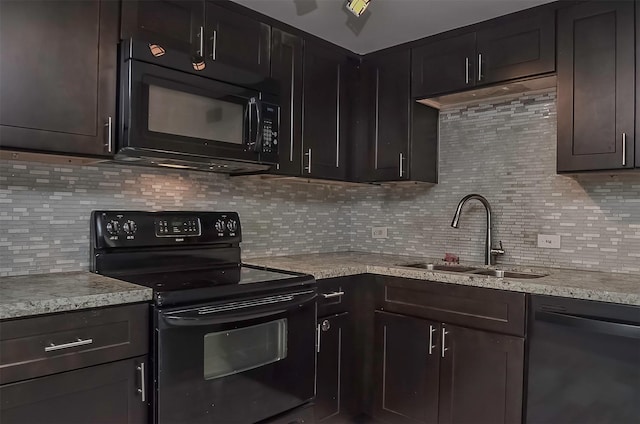 kitchen with black appliances, dark brown cabinets, sink, and tasteful backsplash