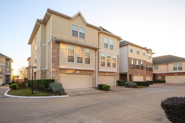 townhome / multi-family property featuring a garage