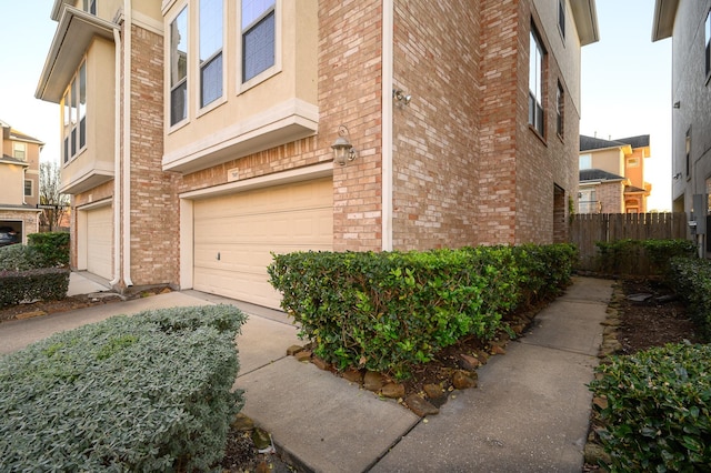 view of side of home featuring a garage