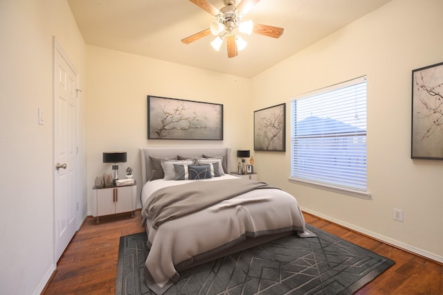 bedroom featuring dark hardwood / wood-style floors and ceiling fan