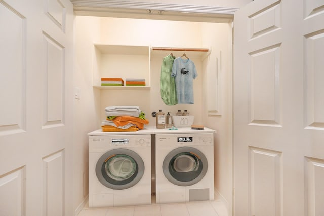 laundry area featuring light tile patterned flooring and independent washer and dryer