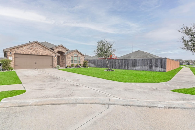 ranch-style home featuring a front yard and a garage