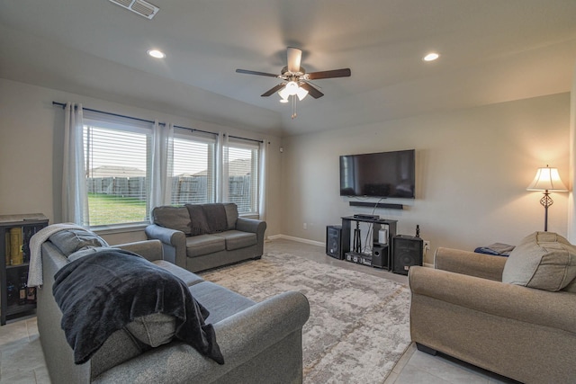 living room featuring ceiling fan and light tile patterned flooring