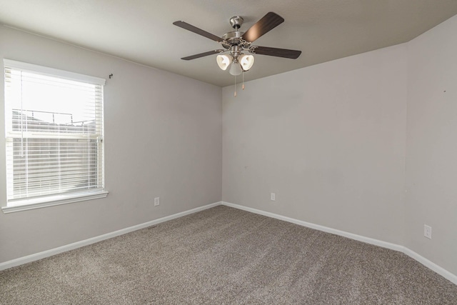 unfurnished room with carpet and ceiling fan