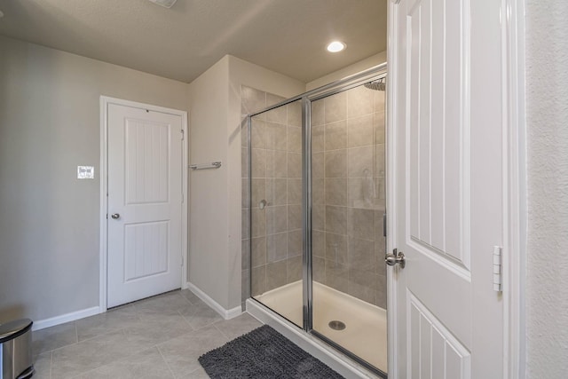 bathroom featuring tile patterned floors and walk in shower