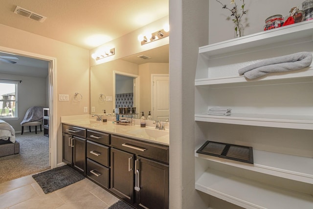 bathroom with tile patterned floors and vanity