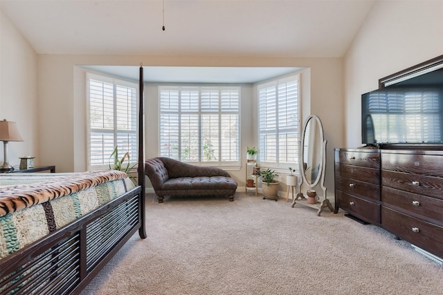 carpeted bedroom featuring vaulted ceiling