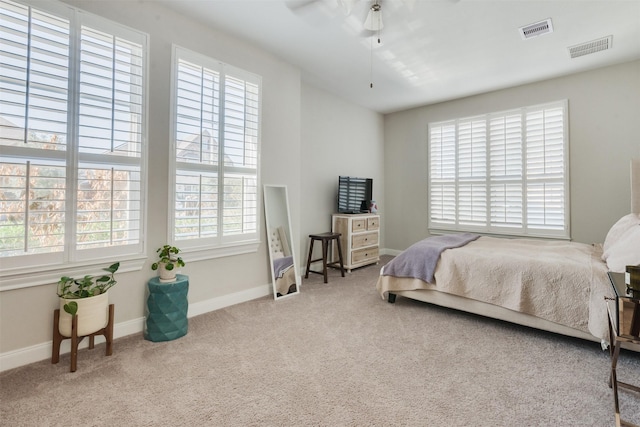 carpeted bedroom featuring ceiling fan