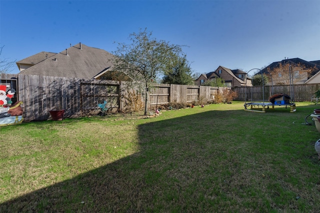 view of yard with a trampoline