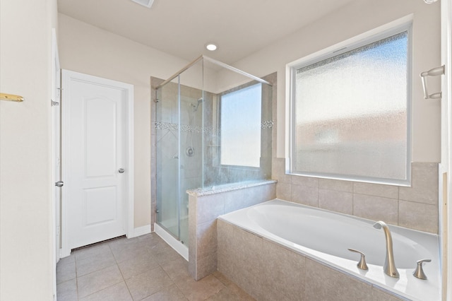 bathroom with tile patterned flooring and plus walk in shower