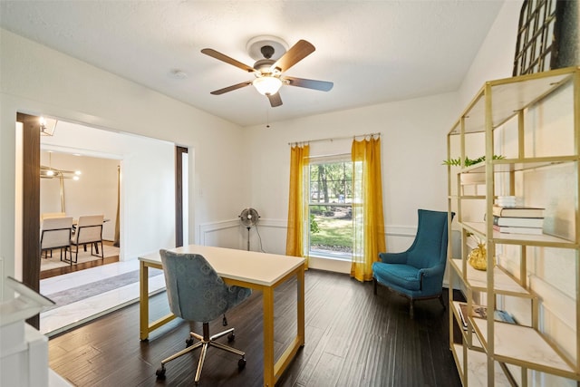 home office with ceiling fan and dark wood-type flooring