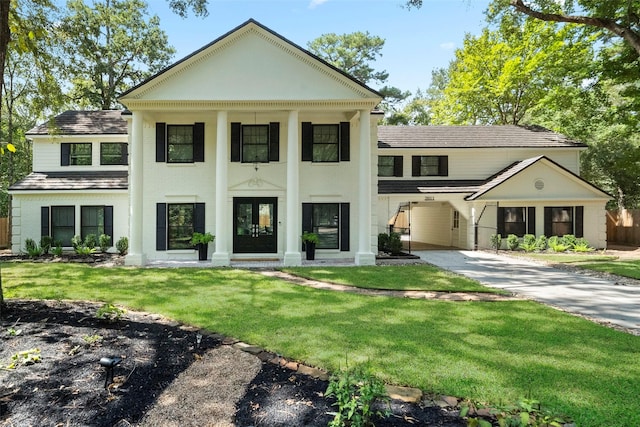 greek revival house with a front lawn