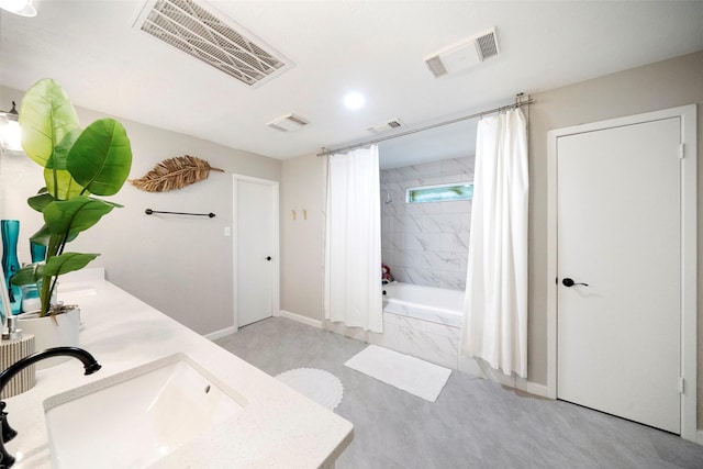 bathroom featuring vanity and shower / bath combination with curtain