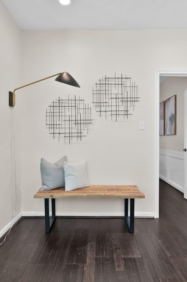 mudroom featuring wood finished floors and baseboards