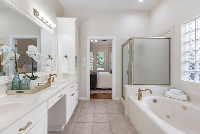 bathroom featuring plus walk in shower, tile patterned flooring, and vanity