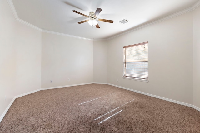 carpeted spare room featuring ceiling fan and crown molding