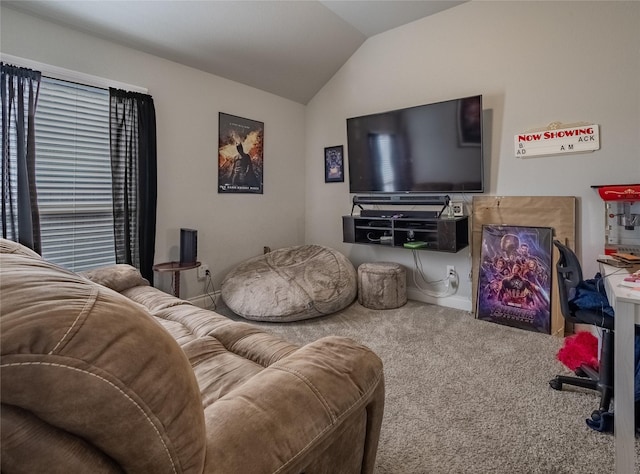 carpeted living room featuring lofted ceiling