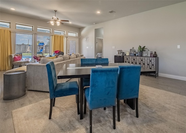 dining room featuring ceiling fan and light hardwood / wood-style floors